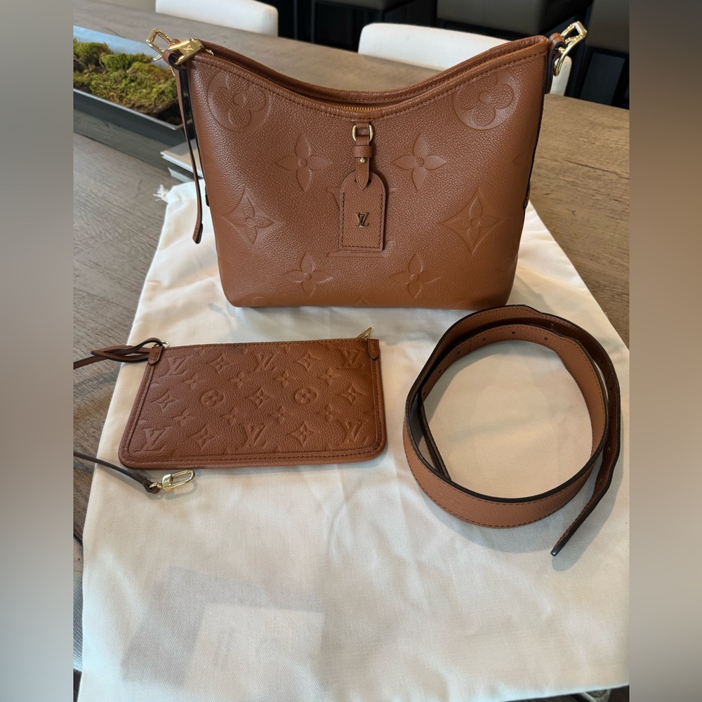 Authentic Louis Vuitton Empreinte Carryall PM bag in Cognac